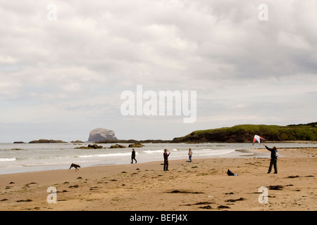 People flying a kite on the beach at North Berwick Stock Photo