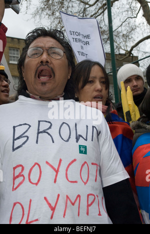 Tibetan man in t-shirt 'Brown - Boycott Olympics'  at a packed rally in London with the Tibetan Freedom Torch Relay Stock Photo