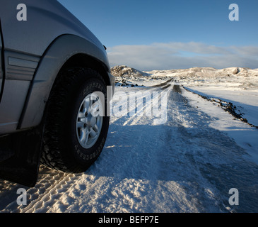 Driving on snowy road, winter, Iceland