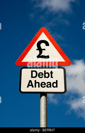Digital concept of debt ahead with british pound symbol on a road sign close up Stock Photo