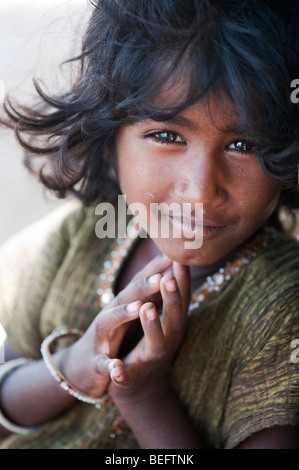 Young Indian street girl greeting with folded hands. Selective focus Stock Photo