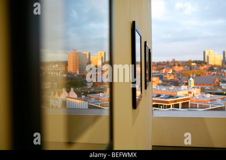 The New Art Gallery, Walsall, Walsall is reflected in the framed artwork on display. Stock Photo