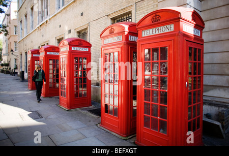 Five British red phone boxes in a row near Covent Garden in central London, UK Stock Photo