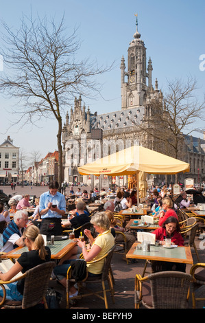 A street cafe at the market square in front of the late-Gothic town hall of Middelburg. Stock Photo