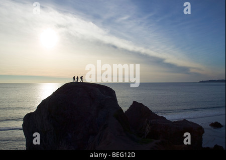 Climbers on large rock, Pacific Ocean, north of San Francisco, California, USA Stock Photo