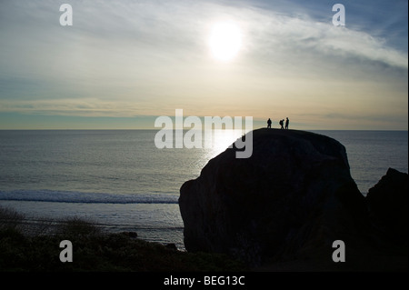 Climbers on large rock, Pacific Ocean, north of San Francisco, California, USA Stock Photo