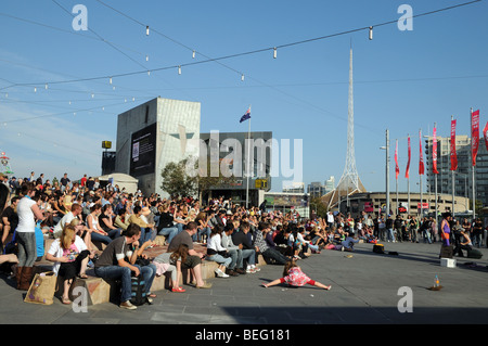 Crowd watching Street theatre on Federation Square Melbourne Australia Stock Photo