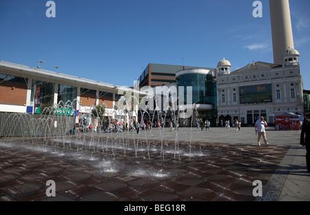 fountain water display in williamson square with the playhouse in the background in liverpool city centre liverpool Stock Photo