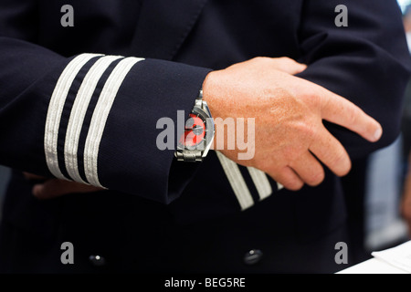 Safe pair of pilot's hands in the British Airways Crew Report Centre at Heathrow Airport's Terminal 5. Stock Photo