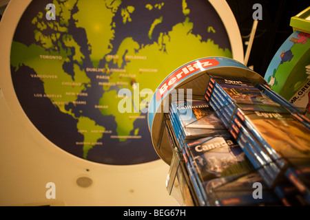 WH Smiths Berlitz travel literature on sale in departures shopping area of Heathrow airport's Terminal 5. Stock Photo