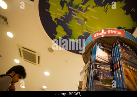 WH Smiths Berlitz travel literature on sale in departures shopping area of Heathrow airport's Terminal 5. Stock Photo