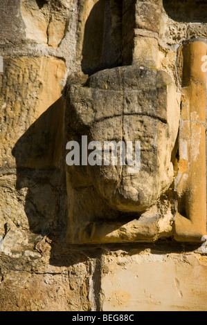 Stone carving of a face on the church of St Mary's, Newick, Sussex, England Stock Photo