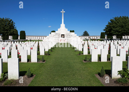 View over Tyne Cot Military Cemetery to the Cross of Sacrifice. First World War British cemetery with 11,856 white tombstones. Stock Photo