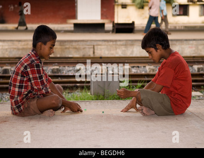 Two young porters are playing in free time at Kamalapur Rail Station, Dhaka Stock Photo