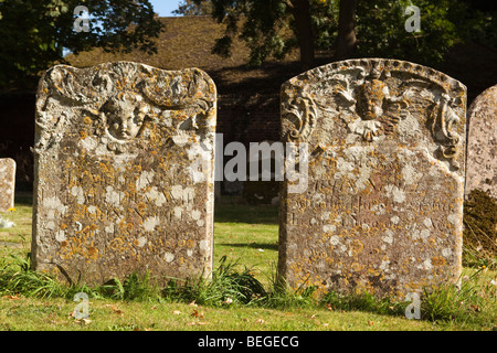 England, Cambridgeshire, Hemingford Grey, St James’ Church, two old headstones in churchyard Stock Photo