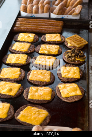 Burger bread with sesame is heating on a grill pan. Process of cooking self  made burgers at home Stock Photo - Alamy