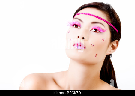 Face with colorful makeup and eyelashes isolated on white Stock Photo