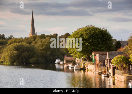 England, Cambridgeshire, St Ives, private boating mooring on River Great Ouse below All Saints Church spire Stock Photo