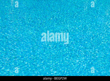Blue tiles and ripples of water in a 'swimming pool' Stock Photo