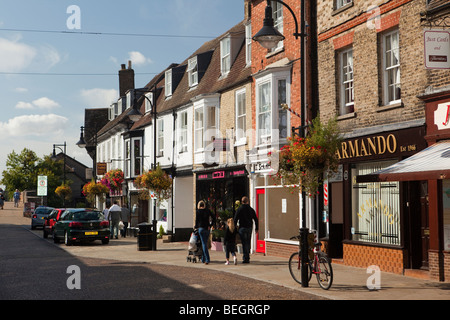 England, Cambridgeshire, St Ives, Bridge Street, shops in part-pedestrianised road Stock Photo