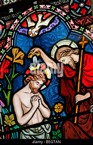 Detail from a stained glass window by Frederick Preedy depicting the baptism of Christ, Church of St Mary the Virgin, Gunthorpe, Norfolk Stock Photo