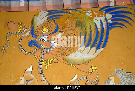 Mural of a Garuda painted in traditional Bhutanese style on a wall in Wangdichholing Dzong. Bhutan. Stock Photo