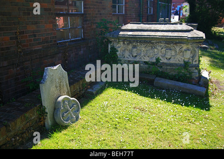 Damaged gravestone in the churchyard of St Mary Magdalene, Taunton, Somerset, England, UK Stock Photo