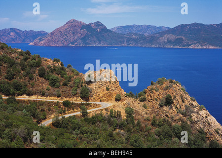 Windy Road around Gulf de Porto Corsica- distant view of Scandola Reserve Stock Photo