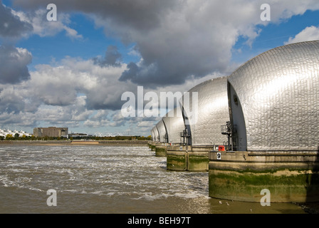 Horizontal upstream close up of the piers at the Thames Flood Barrier closed for maintenance in London on a bright sunny day. Stock Photo