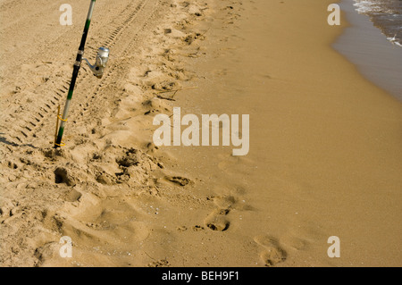 Fishing rod stuck in sand hi-res stock photography and images - Alamy