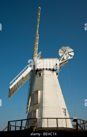 Old white wood Woodchurch windmill against clear blue sky Stock Photo