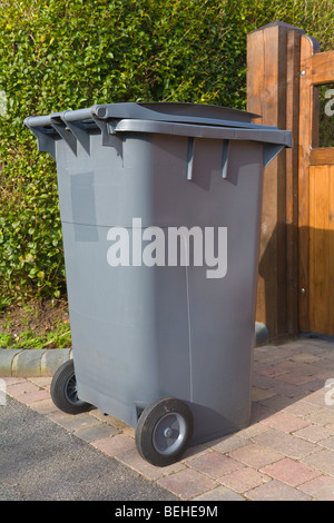 Wheelie bin outside house waiting for refuse collection Stock Photo - Alamy