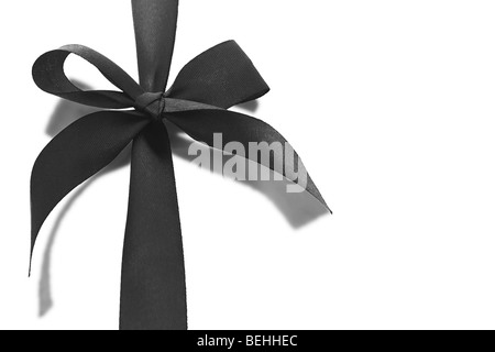 Black bow ribbon with reflection on white background Stock Photo