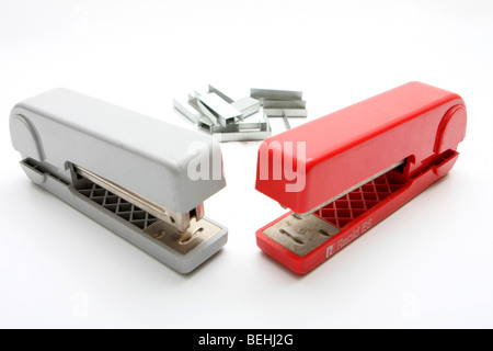 Cutout of a Stapler and pins on white background Stock Photo