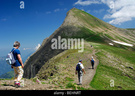 Hikers on the way to the Faulhorn peak, Bernese Oberland Switzerland Stock Photo