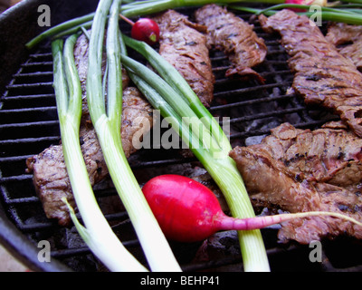 Carne Asada cooking on BBQ Stock Photo