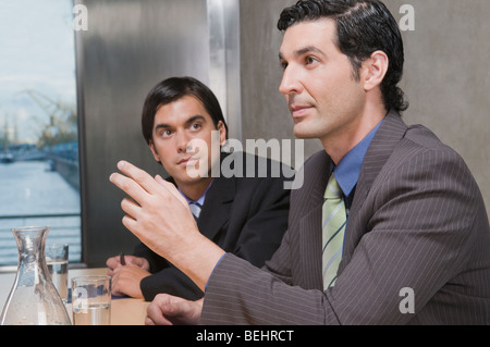 Two businessmen discussing in a conference room Stock Photo
