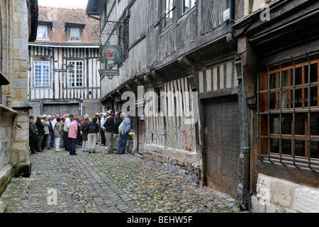 Mediaeval façades of old half timbered houses in alley at Honfleur, Normandy, France Stock Photo