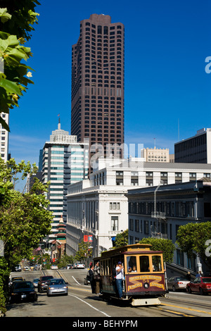 Looking down California Street in San Francisco as a Cable Car climbs the hill. Stock Photo