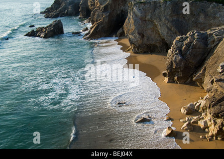 Sandy beach and cliff face at the Côte Sauvage / Wild Coast, Quiberon, Brittany, France Stock Photo