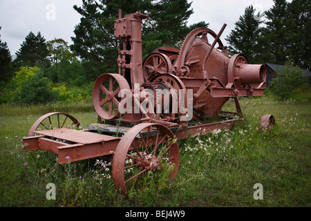 Display of abandoned old mining equipment machinery outdoors in nature nobody none close up at Quincy Mine in Hancock Michigan America USA hi-res Stock Photo