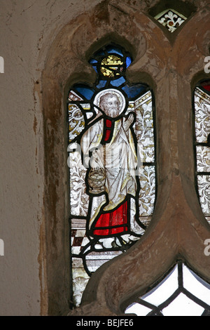 Detail of a medieval stained glass window depicting St Philip the Apostle, St Mary's Church, Stody, Norfolk Stock Photo