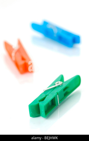 Clothes line pegs isolated against a white background Stock Photo