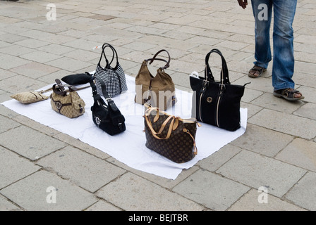 Fake designer handbags for sale. Forgeries, being sold In plain sight. Venice Italy HOMER SYKES Stock Photo