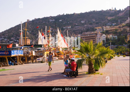 Alanya harbour with ancient city walls beyond in southern Mediterranean Turkey Stock Photo