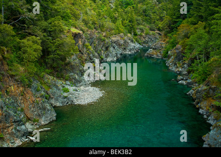 Smith River flowing through forest canyon, Del Norte County, California Stock Photo