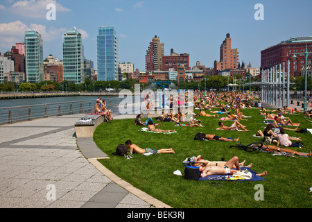 Tanning at Hudson River Park in Manhattan New York City Stock Photo