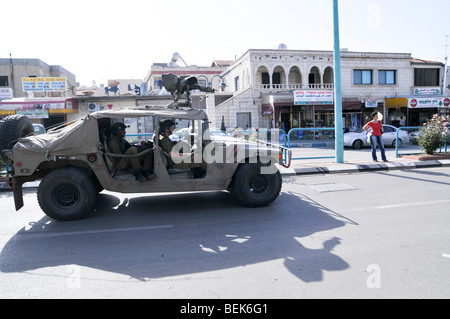 Israel, Golan Heights, The Druze vilege Massade Israeli Military vehicle drives through the village Stock Photo