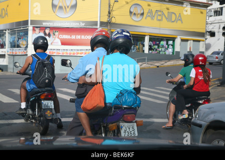 Motorcyclists stopping at traffic lights in the morning. Cuiaba, Mato Grosso, Brazil Stock Photo
