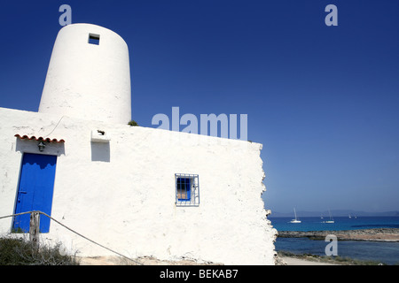 Balearic islands architecture white mill in Formentera over blue sky Stock Photo